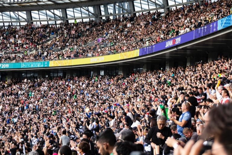 people at the bleachers of the stadium - Cheering crowd at rugby world cup 2019, tags: central contracts - unsplash